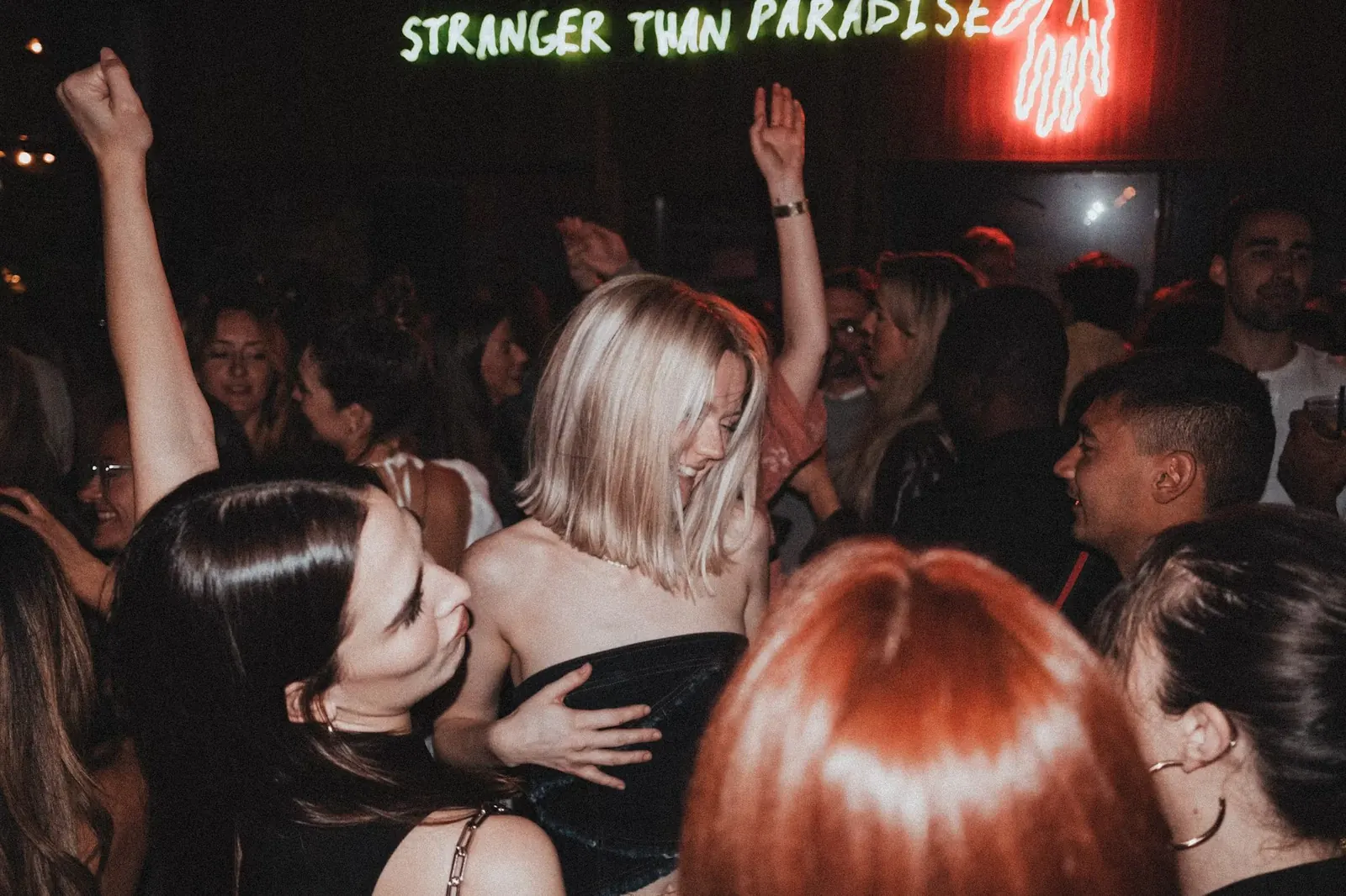 People dancing under concert lights